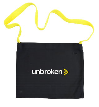 Black Unbroken musette bag with a yellow shoulder strap